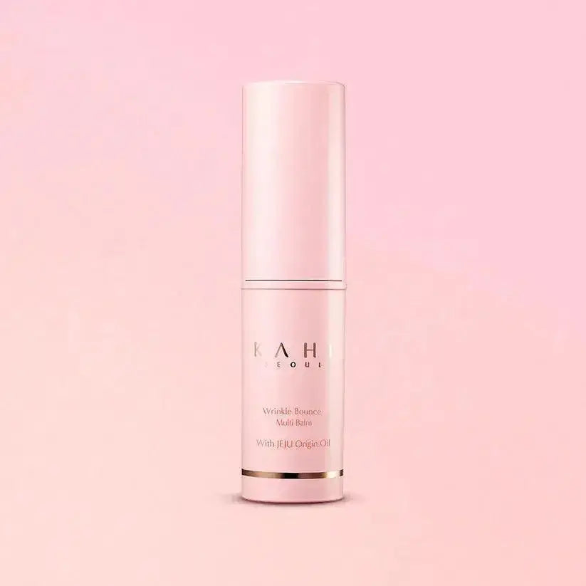 KAHI Wrinkle Bounce Multi Balm 9g in pink packaging against a soft pink background for anti-aging benefits.